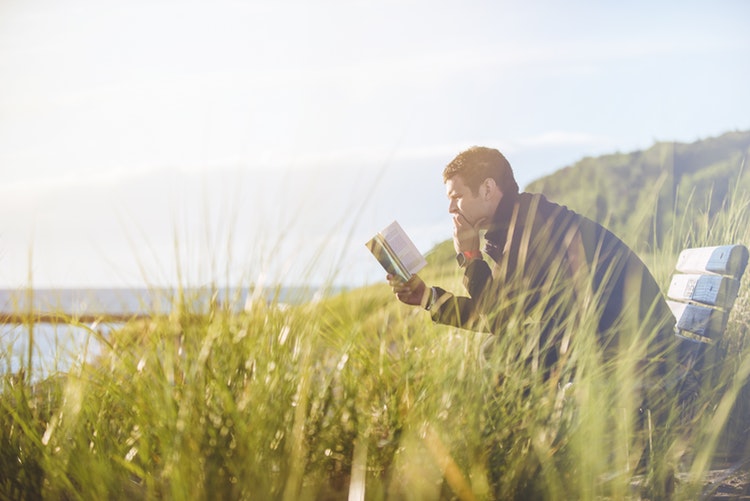 Speed reading - a man on a bench